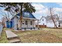 Charming renovated home with a walkway, landscaping and a fresh blue and gray color scheme at 2626 E 18Th St, Indianapolis, IN 46218