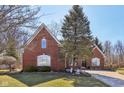Charming brick home with mature tree, landscaping, and meticulous lawn at 351 Mallard Ct, Carmel, IN 46032