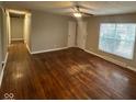 Inviting living room featuring original hardwood floors and lots of natural light at 4616 N Kenmore Rd, Indianapolis, IN 46226