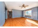 Spacious living room with hardwood floors, a ceiling fan, natural light and an open layout at 4812 Southview Dr, Anderson, IN 46013