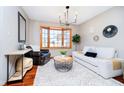 Cozy living room features a bay window, modern decor, and comfortable seating, perfect for relaxation at 5079 Stonespring Way, Anderson, IN 46012