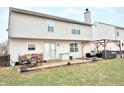 Spacious backyard featuring a patio with outdoor seating and a pergola with comfortable lounge furniture at 6830 Viola Ct, Indianapolis, IN 46237