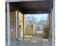 View of a covered brick walkway leading to the backyard, providing a private entrance at 8315 Woodall Dr, Indianapolis, IN 46268