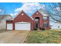 Beautiful two-story red brick home with attached two-car garage and well-manicured lawn at 11185 Beardsley Way, Fishers, IN 46038