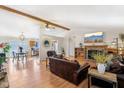 Spacious living room with wood floors, exposed beams, and a cozy fireplace at 1194 S 300 E, Anderson, IN 46017