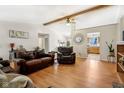 Comfortable living room with wood floors, vaulted ceilings, and leather furniture at 1194 S 300 E, Anderson, IN 46017