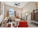 Bright living room boasts large windows, high ceilings, plush seating, and stylish decor for comfortable living at 1542 Waterford Dr, Zionsville, IN 46077