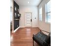 Bright entryway with wood floors, accent wall, and modern decor at 1818 N Cornell Ave, Indianapolis, IN 46202