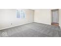 Bedroom showing carpet, a window, and neutral wall color at 3130 Elizabeth St, Indianapolis, IN 46234