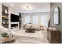 Inviting living room with an electric fireplace, comfortable seating, and modern decor at 4321 Barrel Ln, Westfield, IN 46062