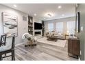 Cozy living room featuring an electric fireplace, stylish furnishings, and bright, natural light at 4321 Barrel Ln, Westfield, IN 46062