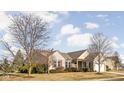 Beautiful single story home with brick facade, red shutters, mature trees, and well-maintained lawn at 649 Hummingbird Dr, Brownsburg, IN 46112