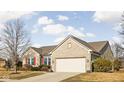 Attractive single-Gathering home featuring an attached two-car garage, brick, and a well-kept lawn at 649 Hummingbird Dr, Brownsburg, IN 46112