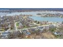 Stunning aerial view of a lakeside community featuring beautiful homes and waterfront access at 9914 Springstone Rd, Fishers, IN 46055