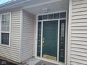Inviting front entrance with a green door, sidelights, and a transom window at 1017 Lincoln Park E Dr, Greenwood, IN 46142
