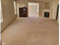 Spacious living room featuring a fireplace, carpet flooring, and ample natural light at 1017 Lincoln Park E Dr, Greenwood, IN 46142