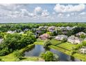Aerial view of the neighborhood with a pond showing the home's great location at 10541 Titan Run, Carmel, IN 46032