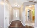Inviting foyer with hardwood floors, white trim, and an open view to other rooms at 1325 E 47Th St, Anderson, IN 46013