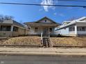 Classic home exterior with a covered porch and inviting curb appeal at 1709 Central Ave, Anderson, IN 46016