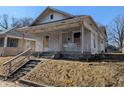 Traditional home showcasing a covered front porch and architectural details at 1709 Central Ave, Anderson, IN 46016