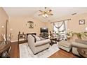 A cozy living room with vaulted ceilings, plush seating, and natural light, perfect for relaxation and gatherings at 2027 Ferdinand Ct, Indianapolis, IN 46234