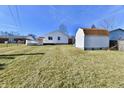 Spacious backyard featuring a shed, a white privacy fence, and a deck for outdoor entertaining at 2521 Beechcrest Dr, Indianapolis, IN 46203