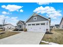 Charming single-story home with stone accents, a two-car garage, and a well-manicured lawn at 2691 Sand Hollow Dr, Lebanon, IN 46052