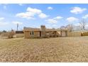 Lovely single-story brick home with a well-maintained lawn and storage shed at 305 Bixler Rd, Indianapolis, IN 46227