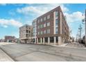 Street view showcasing the building's architecture and surrounding neighborhood at 319 E 16Th St # 203, Indianapolis, IN 46202