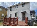 Backyard view with a wooden deck, offering a private outdoor space at 341 N Bolton Ave, Indianapolis, IN 46219