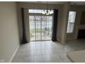 Bright dining area with a sliding glass door that provides views of the backyard and pond at 4088 Weston Pointe Dr, Zionsville, IN 46077