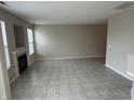 Open-concept living area showcasing tile floors, a fireplace, and large windows at 4088 Weston Pointe Dr, Zionsville, IN 46077