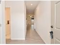 Bright entryway featuring light-colored wood floors and white walls, creating a clean, welcoming space at 5176 Green Valley Ln, Noblesville, IN 46062