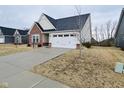 A well-maintained home boasting brick accents, siding, and a neatly paved driveway at 5176 Green Valley Ln, Noblesville, IN 46062