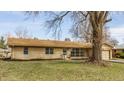 Beautiful one-story brick home featuring a well-maintained front yard and classic architectural design at 5210 Ashbourne Ln, Indianapolis, IN 46226
