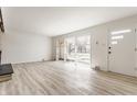 This large living area is filled with natural light and gorgeous floors at 5210 Ashbourne Ln, Indianapolis, IN 46226