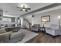 Comfortable living room with an open layout, hardwood floors, and cozy seating arrangements at 10326 Haag Dr, Brownsburg, IN 46112