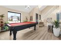 Spacious game room featuring a pool table and an open floor plan with natural light at 10540 Bartley Dr, Indianapolis, IN 46236
