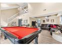 Inviting game room and living room area with a pool table and comfortable seating at 10540 Bartley Dr, Indianapolis, IN 46236