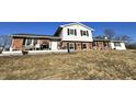 Charming split-level home with brick accents, a white picket fence, and a well-maintained lawn at 1125 S Buffalo Hill Rd, Martinsville, IN 46151