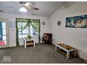 Bright living area with vaulted ceilings, ceiling fan and lots of natural light at 11521 Coastal Dr, Indianapolis, IN 46229