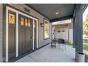 Cozy front porch with a chair and side table, offering a welcoming outdoor space at 1234 S Talbott St, Indianapolis, IN 46225