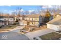 Attractive two-story home on a corner lot with a two-car garage and manicured landscaping at 12377 Traverse Pl, Fishers, IN 46038
