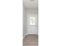 Bright entryway featuring modern wood floors and a glass paneled back door at 1274 Newton St, Avon, IN 46123