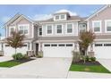 Charming townhome featuring a two-car garage, traditional design, and manicured landscaping at 1274 Newton St, Avon, IN 46123