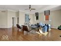 Bright living room featuring hardwood floors, multiple windows, neutral decor, and contemporary furnishings at 141 S Meridian St # 505, Indianapolis, IN 46225