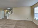 Comfortable living room with stairs to second floor and natural light from window at 14457 Orange Blossom Trl, Fishers, IN 46038