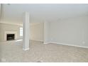 Spacious carpeted basement with a fireplace, perfect for entertaining and relaxation at 18924 Planer Dr, Noblesville, IN 46062