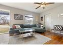 Comfortable living room featuring a large sectional sofa, hardwood floors, and stylish decor at 23 Greenacre Dr, Brownsburg, IN 46112