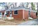 Quaint brick home showcasing a well-maintained exterior and a neatly landscaped yard at 3723 N Olney St, Indianapolis, IN 46218